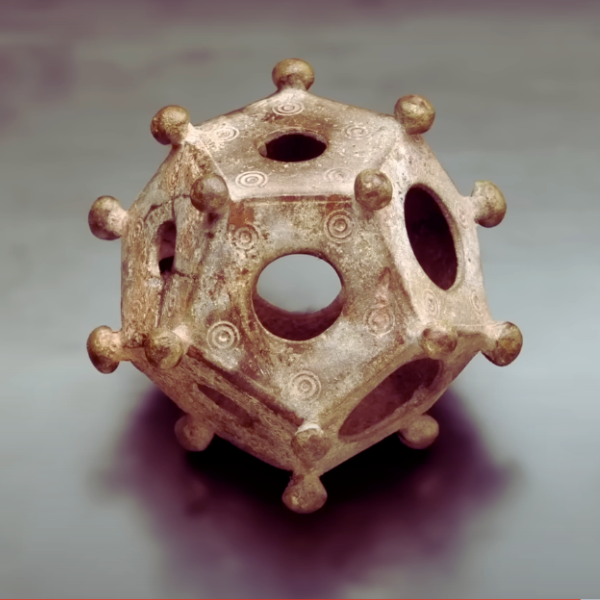 Image of a Roman dodecahedron a 12-sided ancient artifact with holes of varying sizes