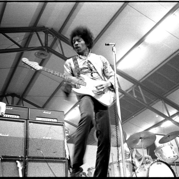 JImi Hendrix on stage playing guitar