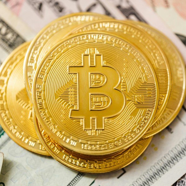 A gold coin with Bitcoin symbol